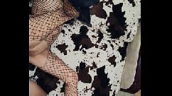 In erotic mesh bodysuit and heels